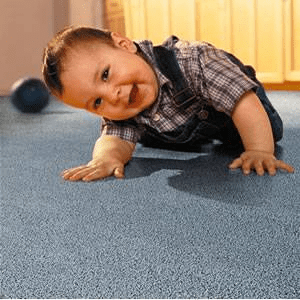 child laying on carpet